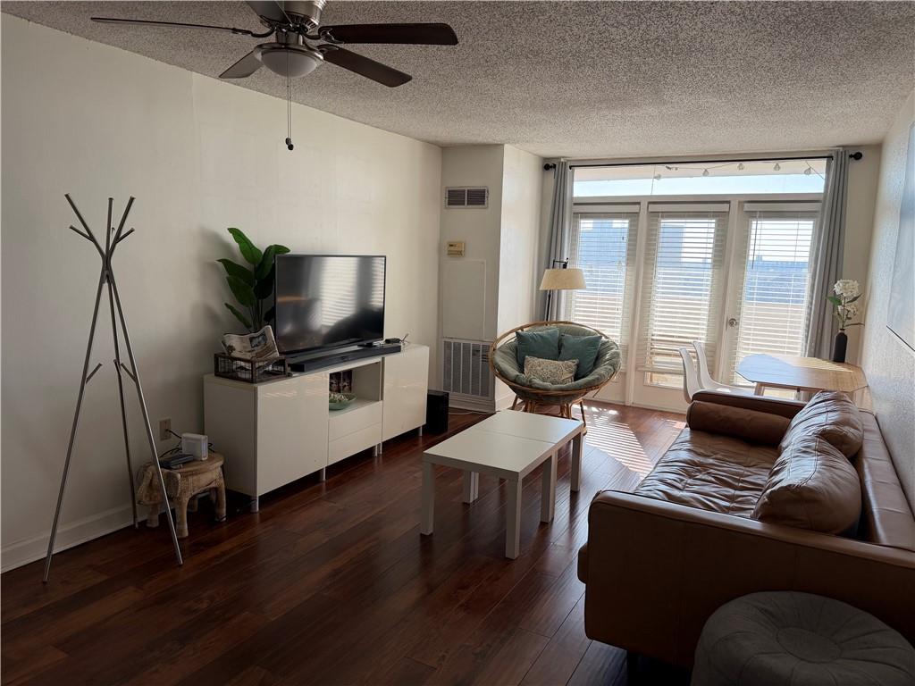 375 Ralph McGill Boulevard Northeast, Unit 1203 Atlanta, GA 30312 - Photo 1 of 12 a living room with furniture and a flat screen tv