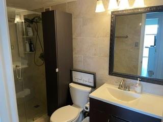 375 Ralph McGill Boulevard Northeast, Unit 1203 Atlanta, GA 30312 - Photo 8 of 12 a bathroom with a sink toilet and shower