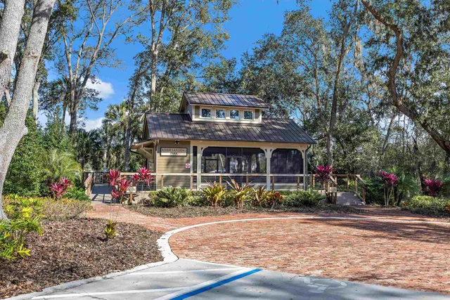 a balcony with outdoor seating and lake view