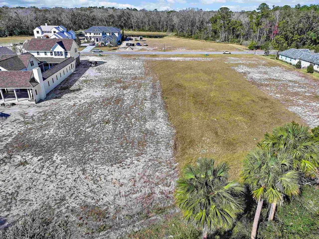 a view of a town with mountains in the background