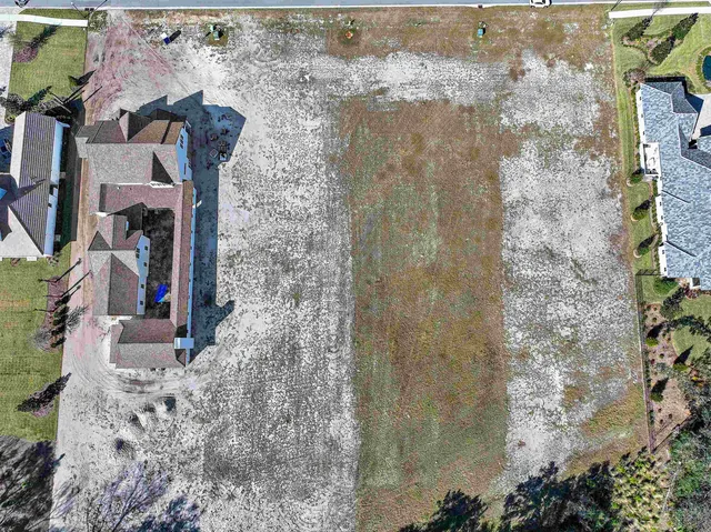 a view of a lake with houses in the back