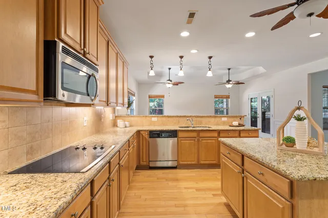 a view of kitchen with cabinets and wooden floor