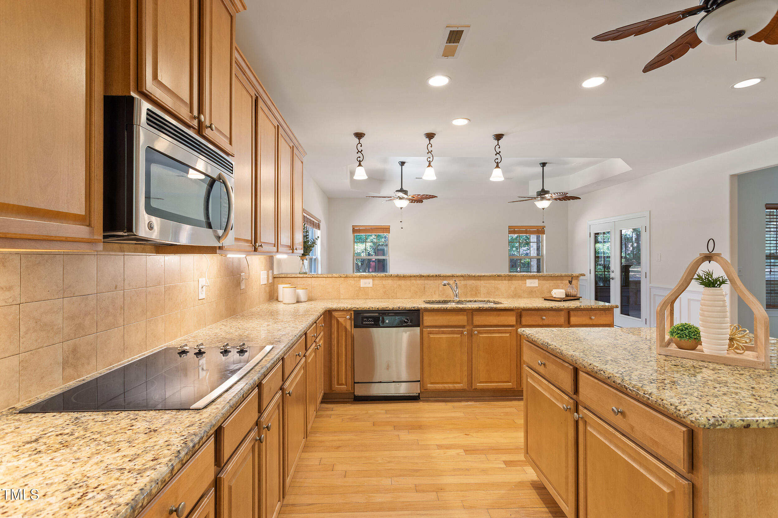 46 Spring Haven Lane Willow Spring, NC 27592 - Photo 12 of 45 a large kitchen with stainless steel appliances granite countertop a sink and a stove