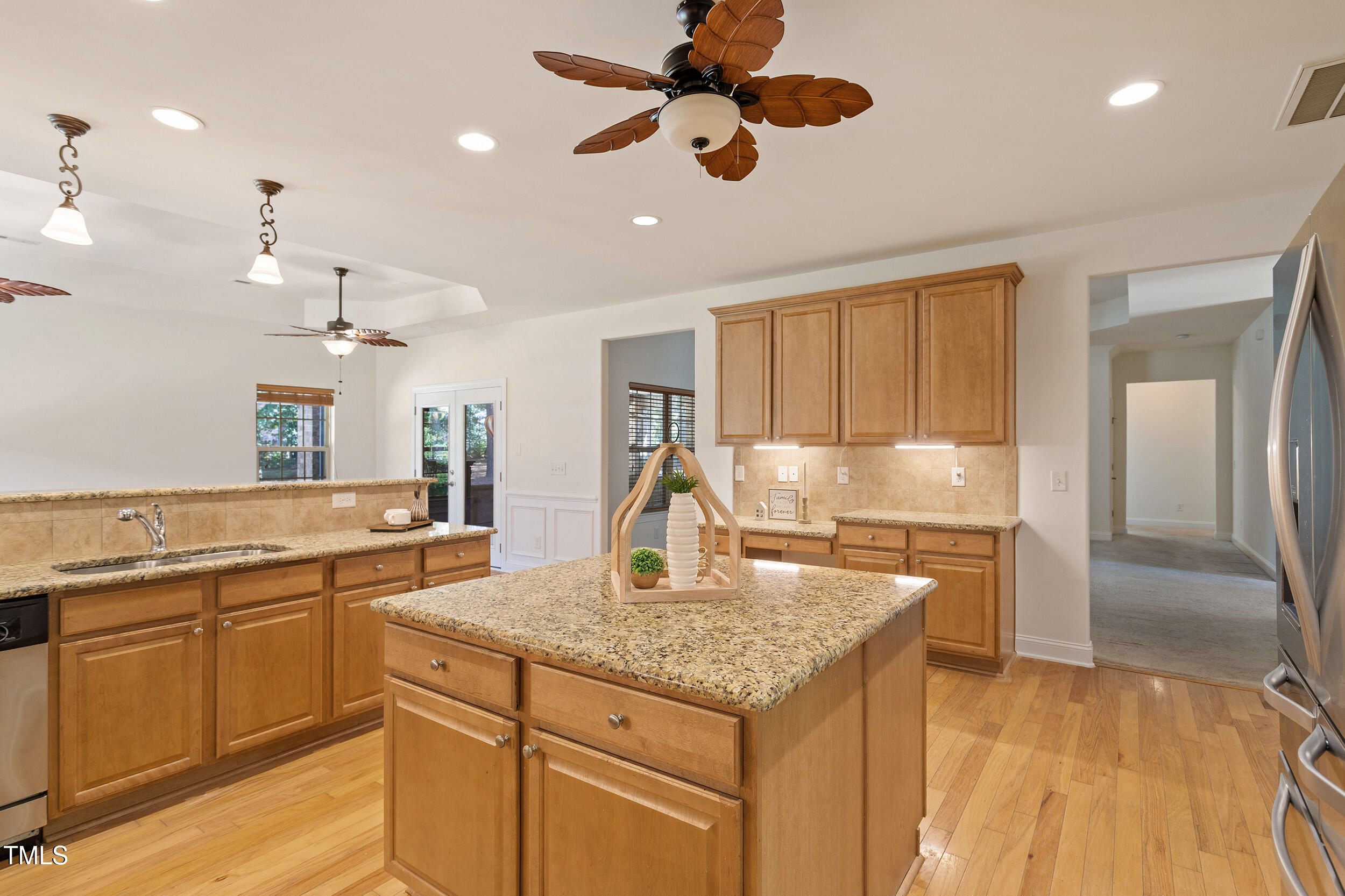46 Spring Haven Lane Willow Spring, NC 27592 - Photo 14 of 45 a kitchen with kitchen island a counter top space a sink stainless steel appliances and cabinets