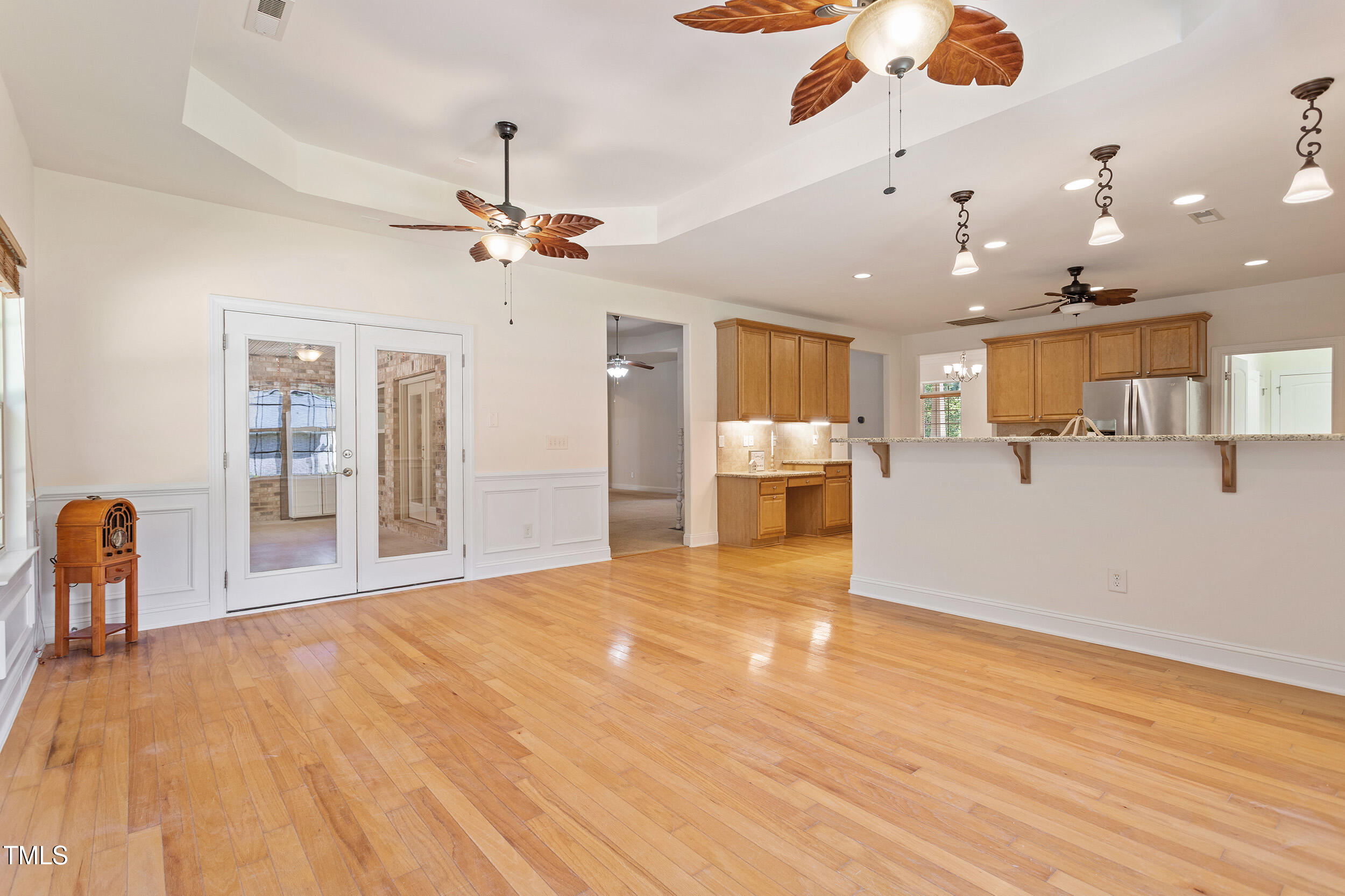 46 Spring Haven Lane Willow Spring, NC 27592 - Photo 18 of 45 a view of a livingroom with furniture a ceiling fan and wooden floor