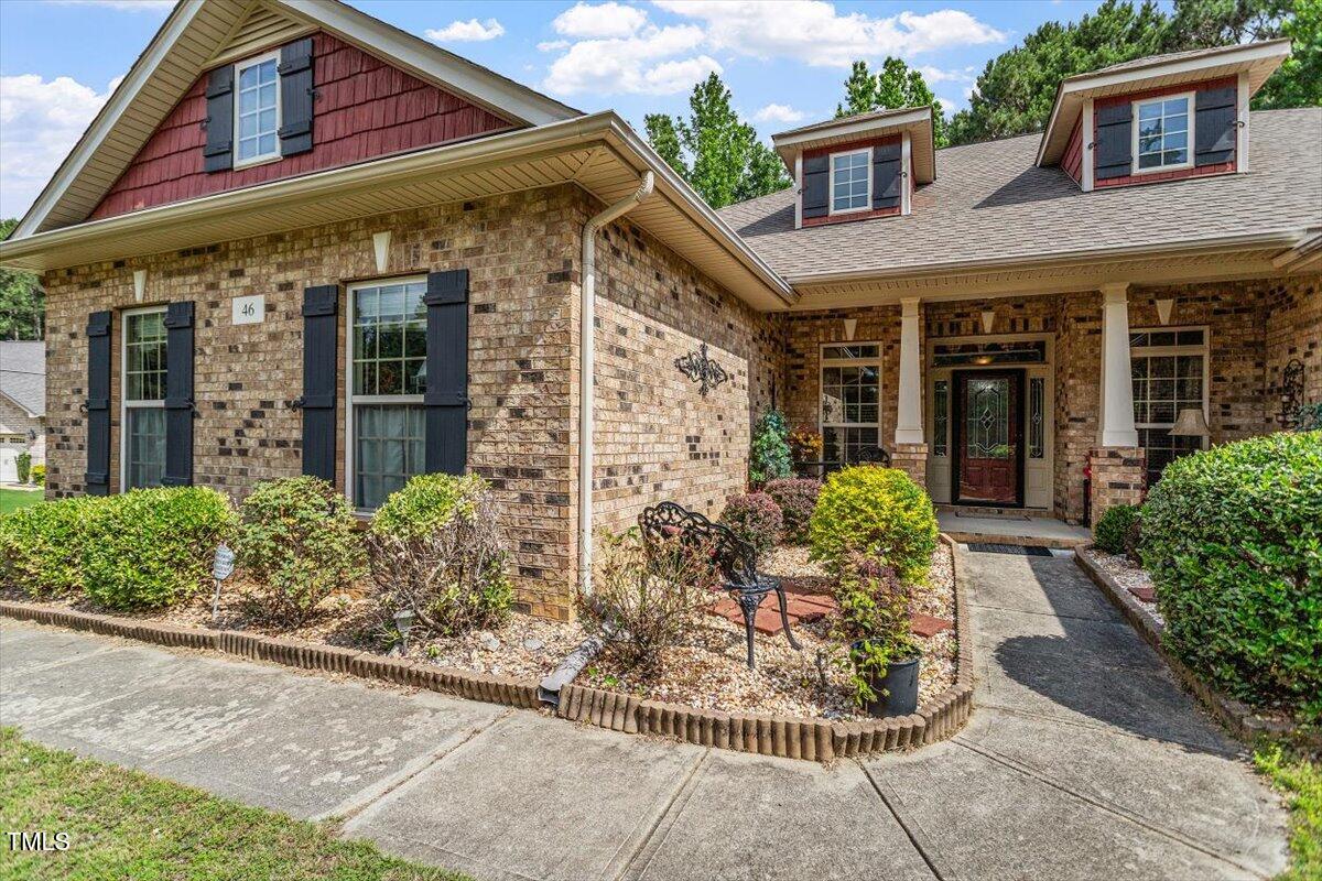 46 Spring Haven Lane Willow Spring, NC 27592 - Photo 2 of 45 front view of a brick house with a large windows