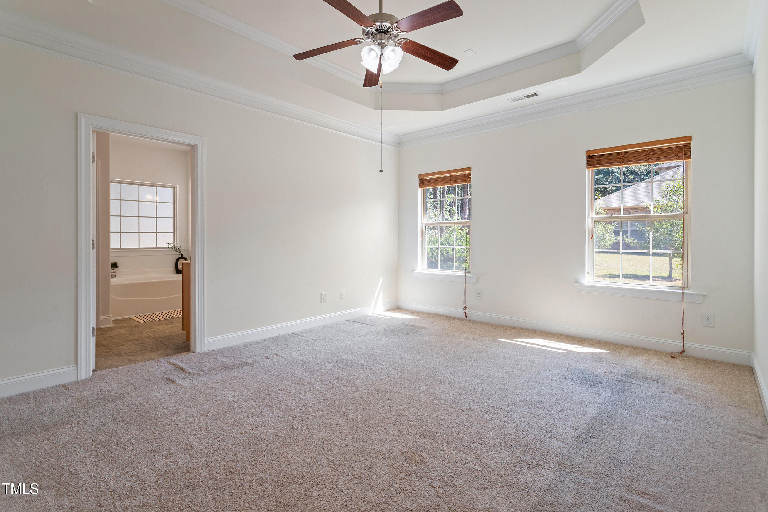 46 Spring Haven Lane Willow Spring, NC 27592 - Photo 26 of 45 an empty room with windows and fan