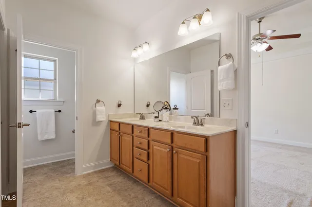 a bathroom with a sink and mirror