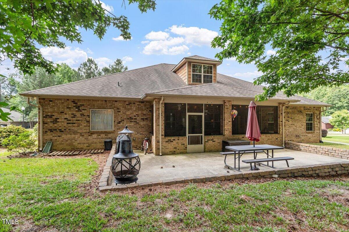 46 Spring Haven Lane Willow Spring, NC 27592 - Photo 39 of 45 a front view of a house with sitting area and garden