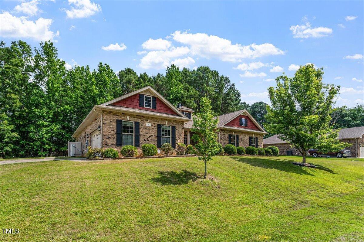 46 Spring Haven Lane Willow Spring, NC 27592 - Photo 45 of 45 a front view of a house with garden