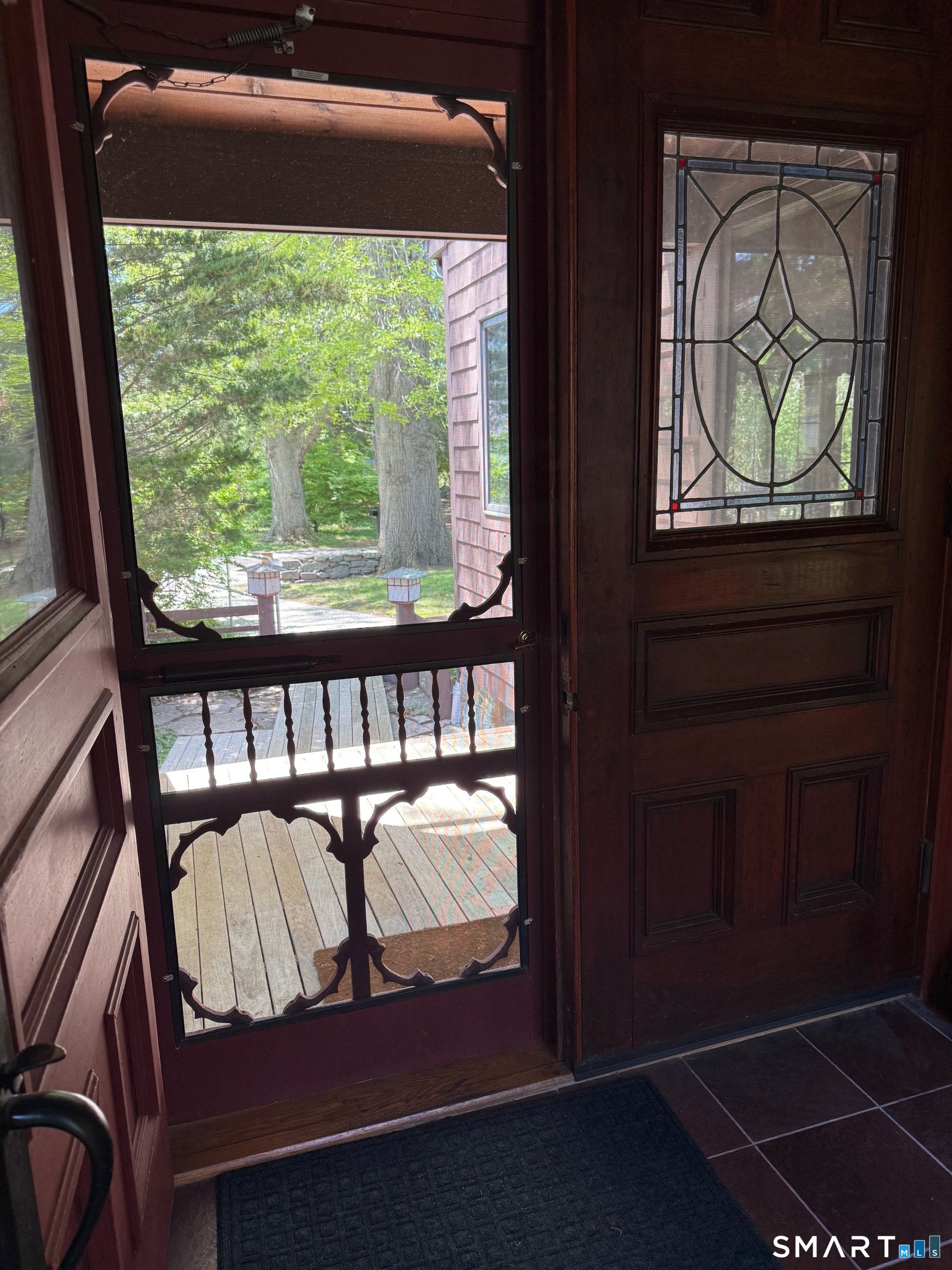 8 Ivy Road Stonington, CT 06355 - Photo 4 of 30 a view of a balcony with furniture and front door