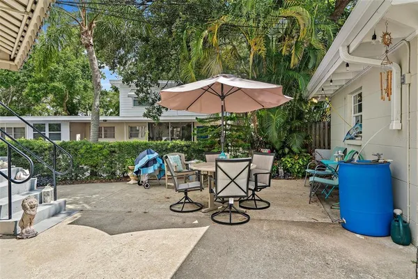 an outdoor space with furniture and umbrella