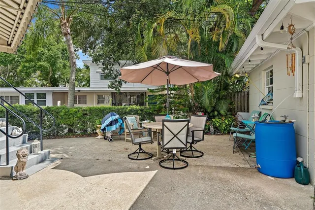 an outdoor space with furniture and umbrella