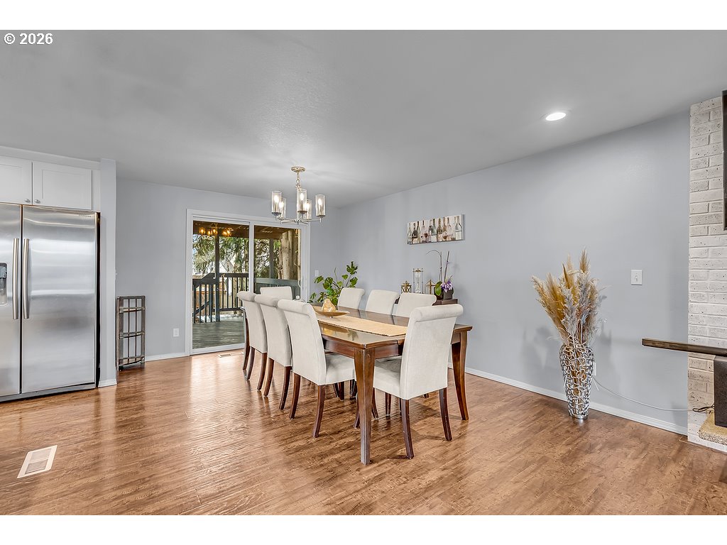 3893 Southwest 4th Street Gresham, OR 97030 - Photo 16 of 48 a dining room with furniture and wooden floor