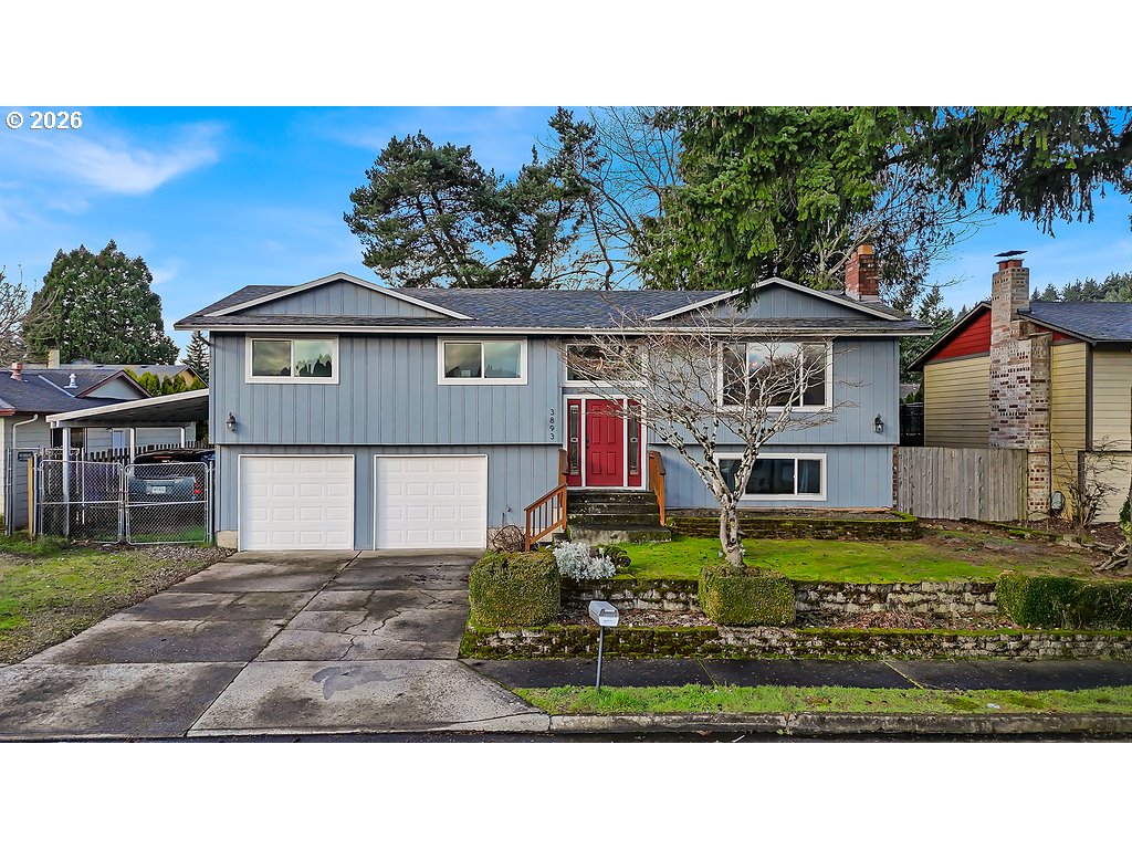 3893 Southwest 4th Street Gresham, OR 97030 - Photo 2 of 48 a house view with a garden space