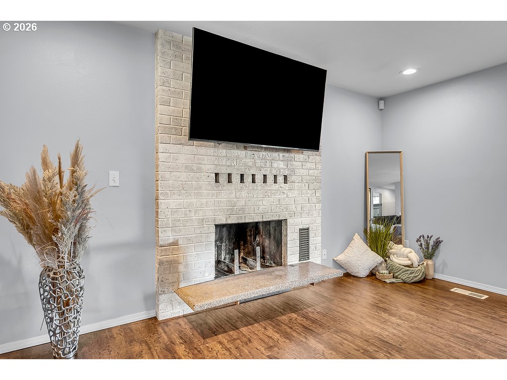 3893 Southwest 4th Street Gresham, OR 97030 - Photo 21 of 48 a living room with furniture fireplace and flat screen tv
