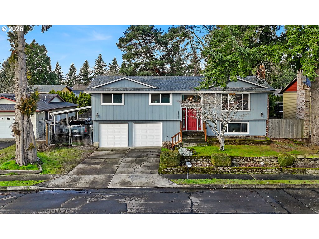 3893 Southwest 4th Street Gresham, OR 97030 - Photo 3 of 48 a view of a house with a yard and potted plants