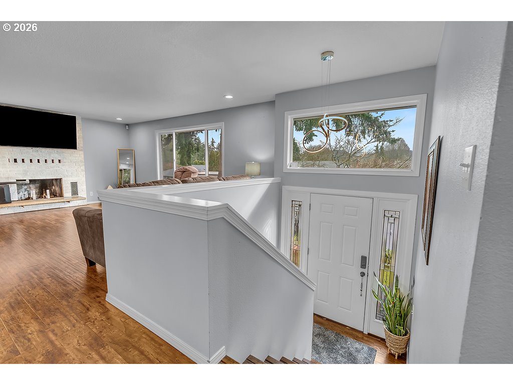 3893 Southwest 4th Street Gresham, OR 97030 - Photo 32 of 48 a living room with stainless steel appliances granite countertop furniture a refrigerator a sink and a microwave