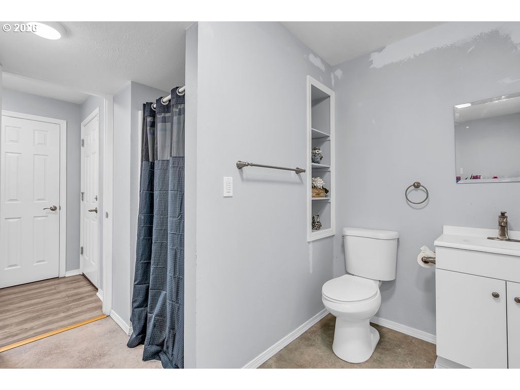 3893 Southwest 4th Street Gresham, OR 97030 - Photo 34 of 48 a bathroom with a toilet and a shower