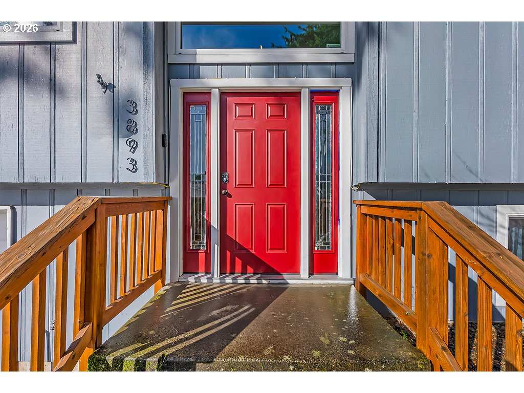 3893 Southwest 4th Street Gresham, OR 97030 - Photo 8 of 48 a view of a red door of the house