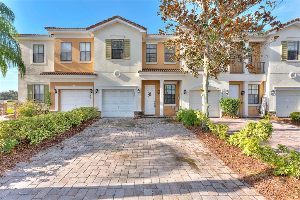 3402 Allegra Circle St. Cloud, FL 34772 - Photo 1 of 1 a front view of a house with garden