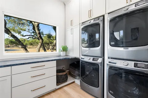 a kitchen with a stove and a washing machine