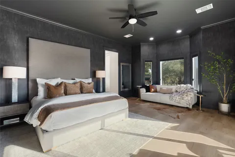 a spacious bedroom with a large bed and a couch