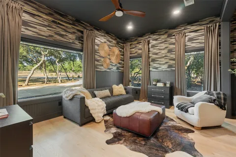 a living room with furniture and a large window