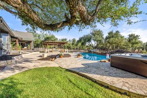 a view of a swimming pool with a patio