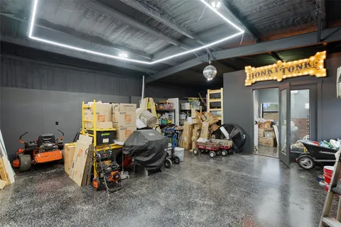 a view of a garage with parked cars
