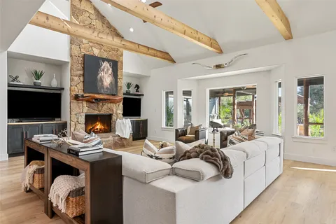 a living room with furniture fireplace and a flat screen tv
