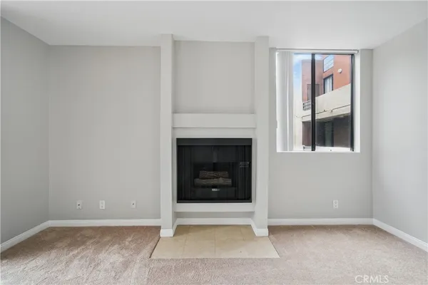 a kitchen with stainless steel appliances a stove microwave and sink