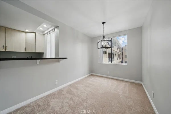 a bathroom with a granite countertop sink and a toilet
