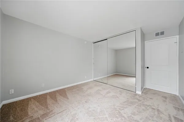 a view of a hallway with a chandelier