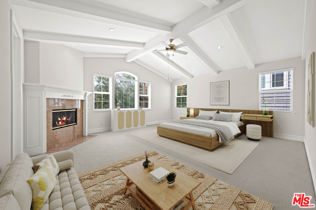 1756 Ruhland Avenue Manhattan Beach, CA 90266 - Photo 12 of 25 a spacious bedroom with a large bed and a fireplace