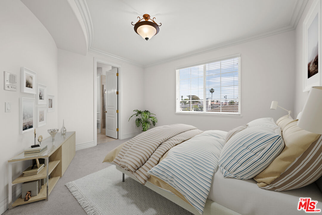 1756 Ruhland Avenue Manhattan Beach, CA 90266 - Photo 14 of 25 a bedroom with a bed and a window