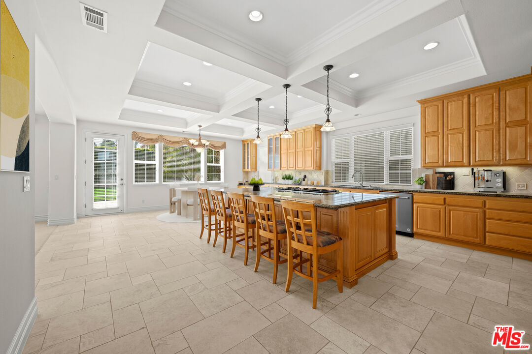 1756 Ruhland Avenue Manhattan Beach, CA 90266 - Photo 5 of 25 a large kitchen with kitchen island granite countertop lots of white cabinets