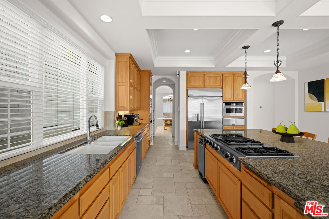 1756 Ruhland Avenue Manhattan Beach, CA 90266 - Photo 6 of 25 a kitchen with stainless steel appliances granite countertop a stove a sink and a refrigerator