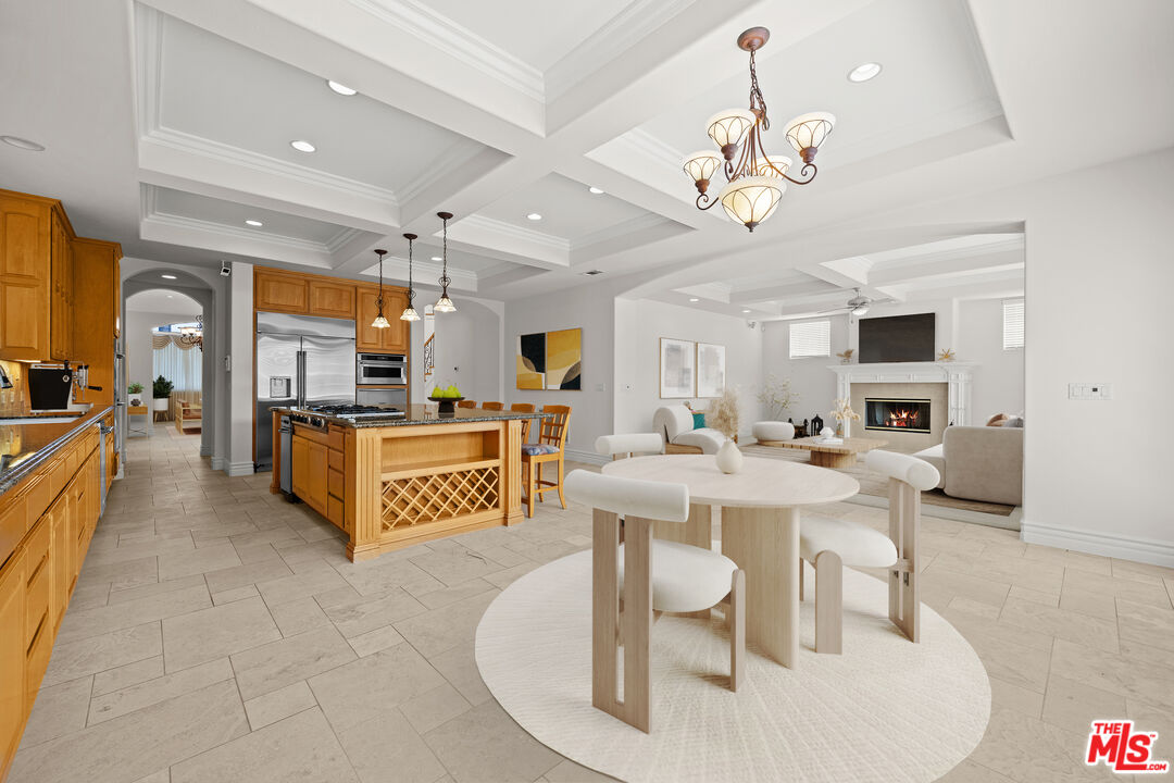 1756 Ruhland Avenue Manhattan Beach, CA 90266 - Photo 7 of 25 a large living room with stainless steel appliances furniture a chandelier and a kitchen view