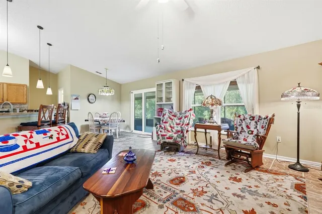 a view of a dining room with furniture wooden floor and chandelier