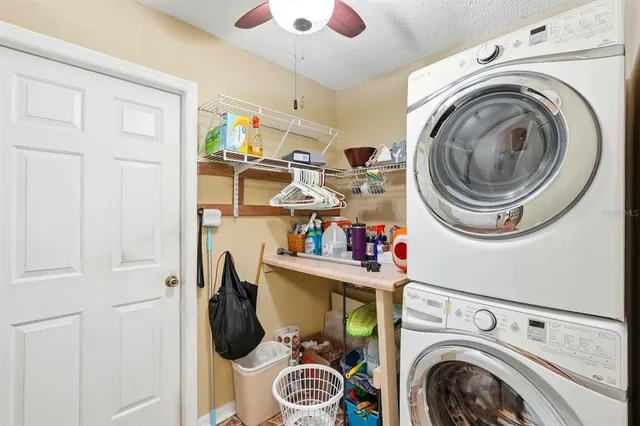 a white bath tub sitting next to a white wooden tub