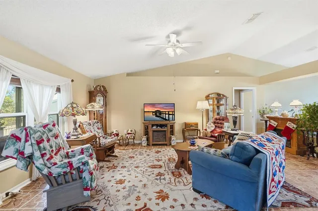 a kitchen with a sink a stove and chairs