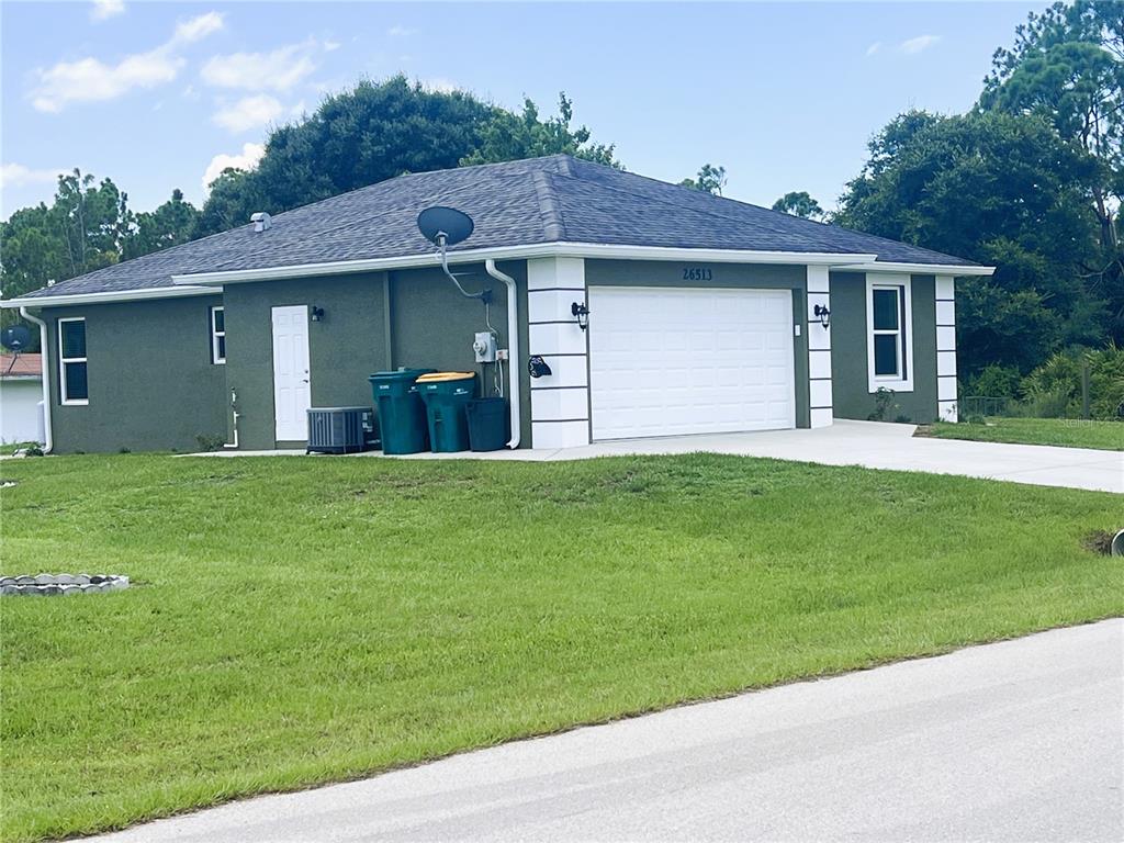 26513 Glaspell Road Punta Gorda, FL 33955 - Photo 4 of 31 Front with 2 car garage
