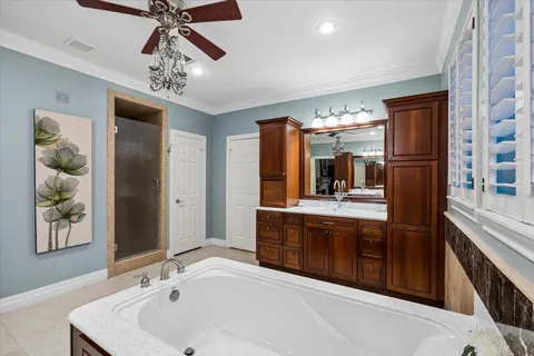 a spacious bathroom with a double vanity sink and a mirror