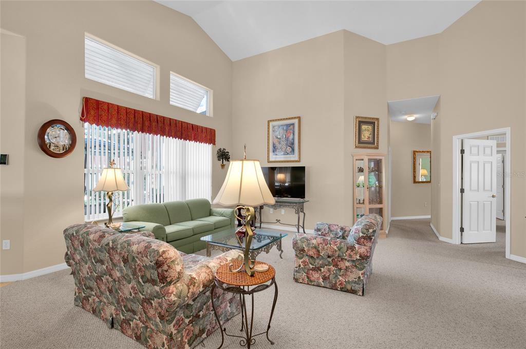 10777 Southwest 71st Circle Ocala, FL 34476 - Photo 12 of 47 a living room with furniture and a large window
