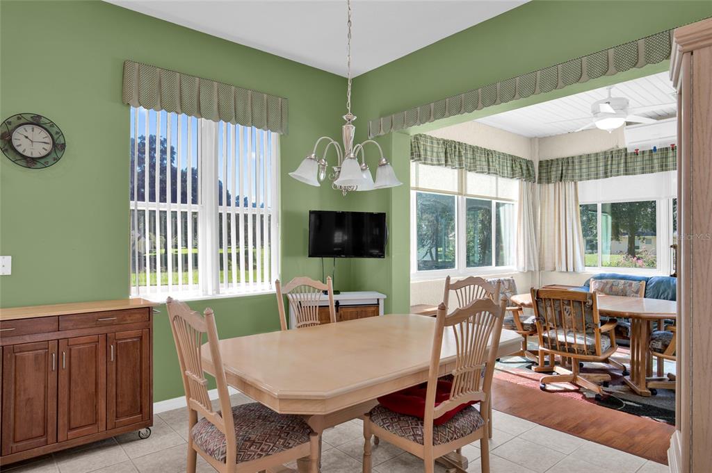 10777 Southwest 71st Circle Ocala, FL 34476 - Photo 19 of 47 a view of a dining room with furniture window and outside view