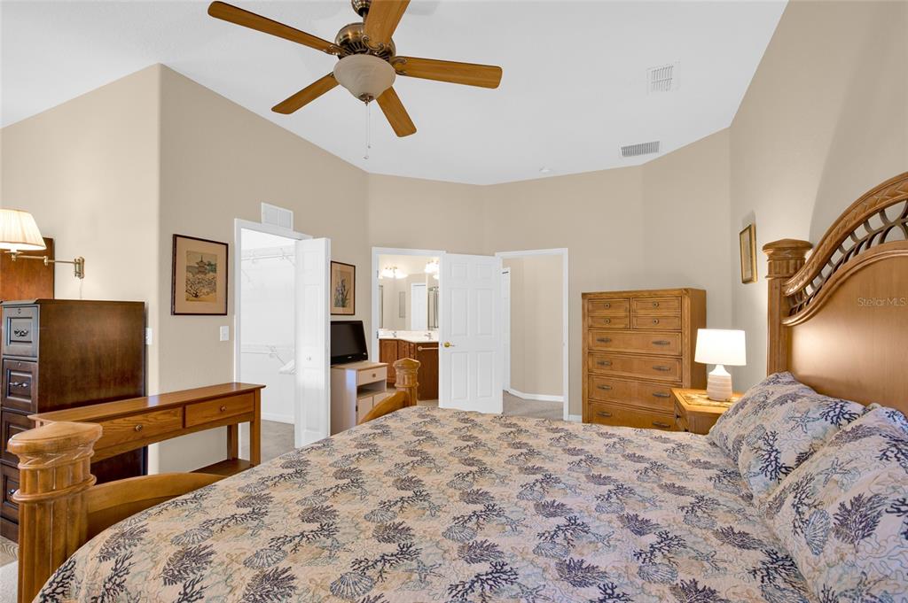 10777 Southwest 71st Circle Ocala, FL 34476 - Photo 23 of 47 a bedroom with furniture and flat screen tv
