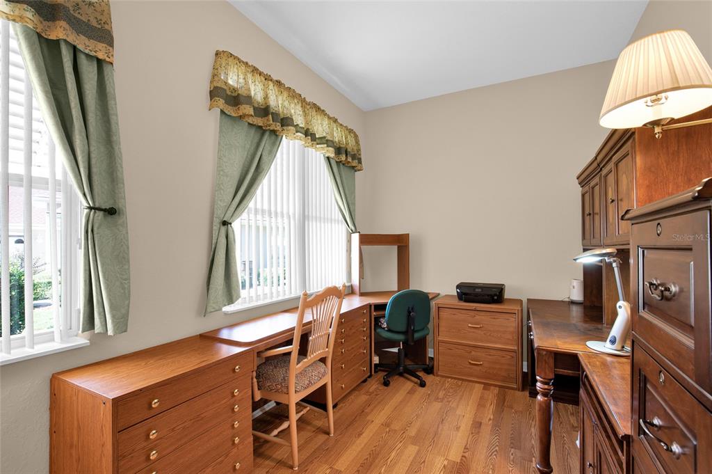 10777 Southwest 71st Circle Ocala, FL 34476 - Photo 26 of 47 a view of a workspace with furniture and a window