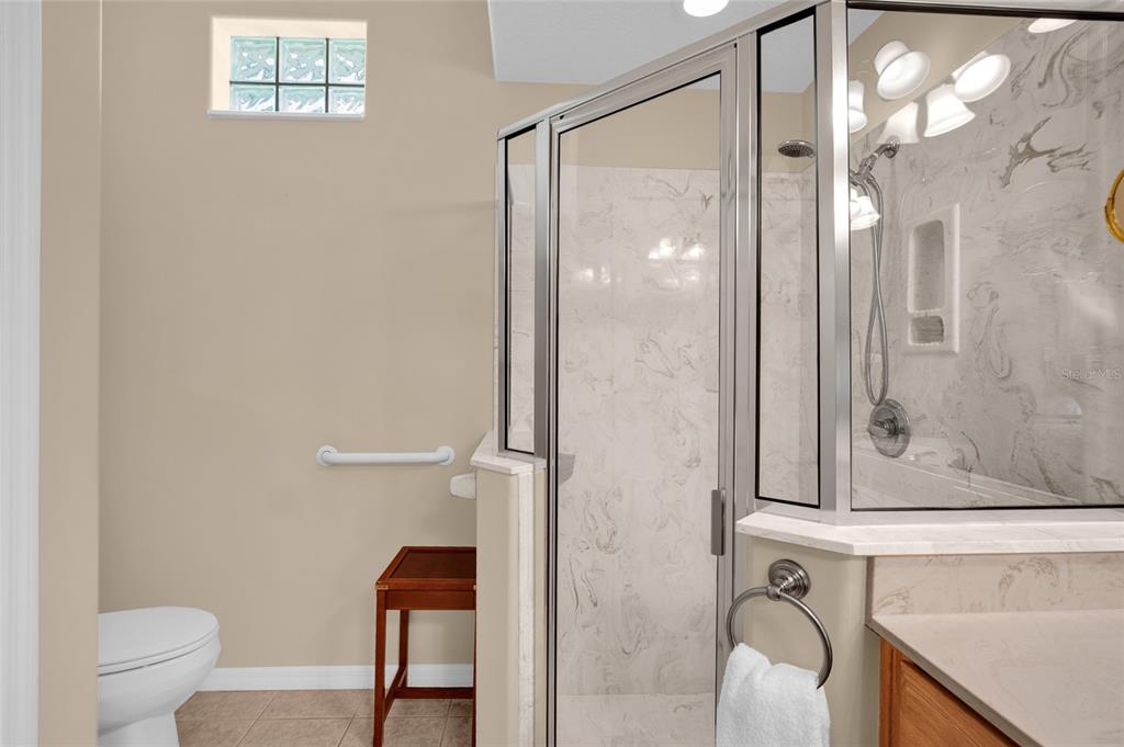 10777 Southwest 71st Circle Ocala, FL 34476 - Photo 30 of 47 a bathroom with a shower a toilet and a sink