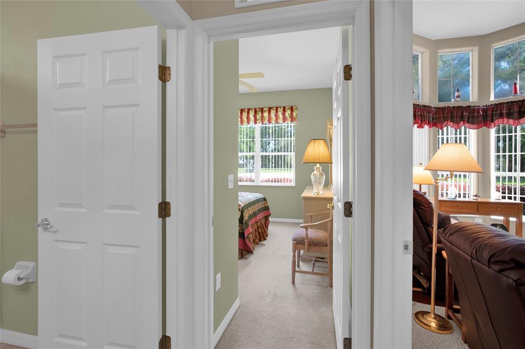 10777 Southwest 71st Circle Ocala, FL 34476 - Photo 31 of 47 a view of hallway with wooden floor and windows